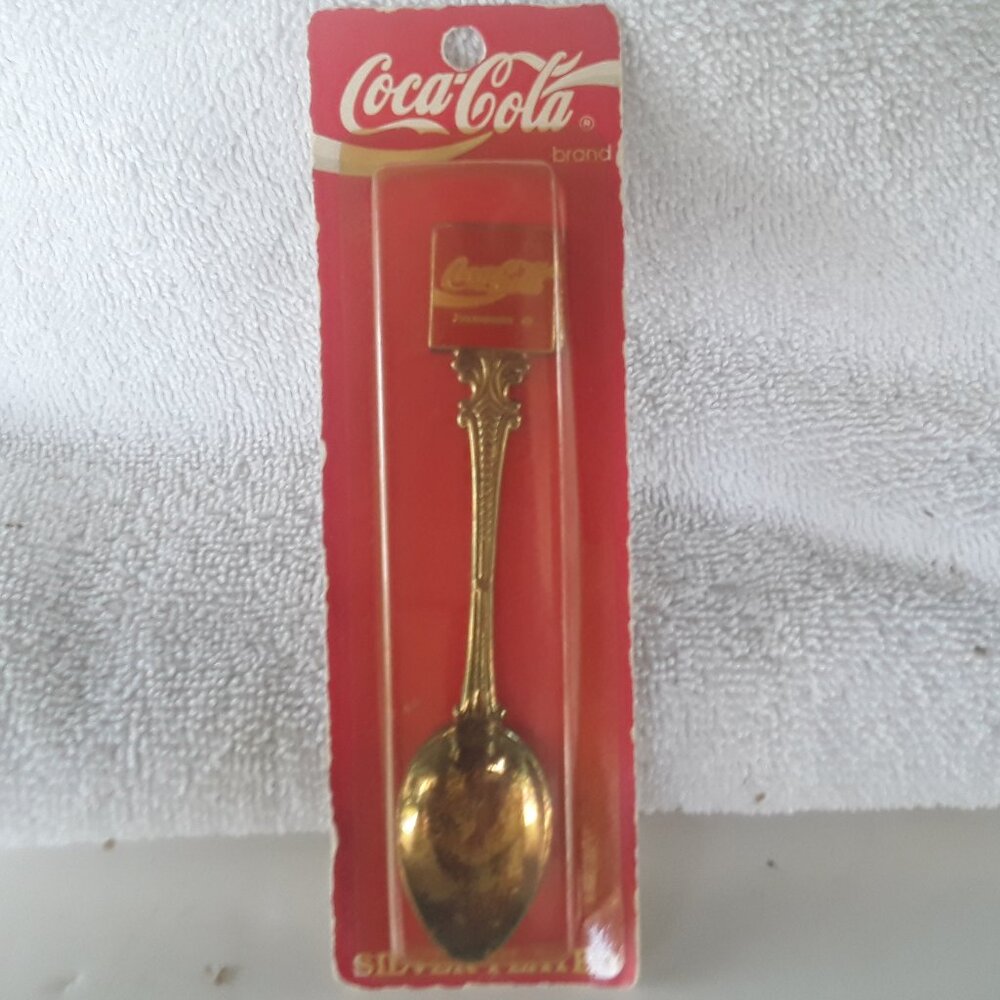 Coca Cola Collectors Spoon- 1991, in box, is tarnished from age.